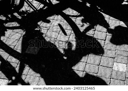 Abstract view created by bicycle shadow.