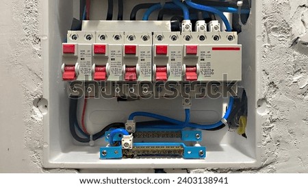 Circuit breaker box being installed in a high-end home Royalty-Free Stock Photo #2403138941
