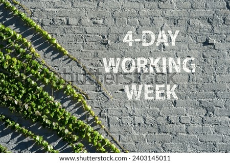 4 - Day working week on a brick wall with green leaves symbolizing nature taking over urban life. Royalty-Free Stock Photo #2403145011