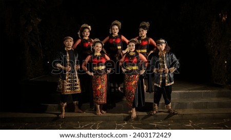 a group of dancers standing very proud and happy after finishing performing on stage at night Royalty-Free Stock Photo #2403172429