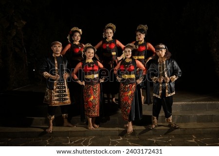 a group of dancers standing very proud and happy after finishing performing on stage at night Royalty-Free Stock Photo #2403172431