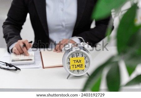 Businesswoman working for tax payment