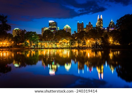 The Atlanta skyline reflecting in Lake Clara Meer in Piedmont Park in Atlanta, Georgia.