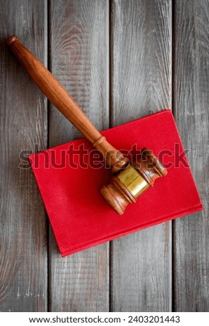 Wooden judge gavel and law book. Court of justice and law concept.