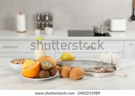 Allergenic food. Different fresh products on light marble table in kitchen Royalty-Free Stock Photo #2403215989