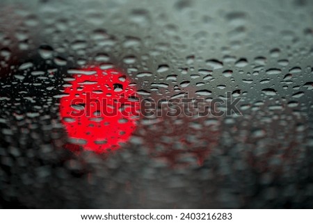 Abstract background for the banner. One night lights of city transport were seen through the windshield in rainy weather. Concept of threat, danger, hazard, peril, menace, jeopardy, imminence Royalty-Free Stock Photo #2403216283