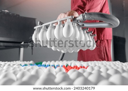 Vacuum pump suction cups for transporting eggs in food factory industry. Royalty-Free Stock Photo #2403240179