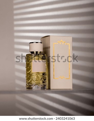 perfume bottle photography idea. men's and women's perfume. Perfume bottle with blank label on studio decorative background. Girl ,man perfume. Modern Luxury bottle