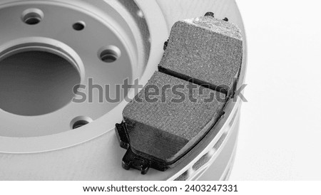 Modern new brake pads for passenger car ventilated disc brakes, brake pads close-up on white background, studio photo Royalty-Free Stock Photo #2403247331