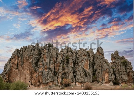 Historical ancient Frig (Phrygia, Gordion) Valley. Houses, structures carved into rocks. Frig Valley is popular tourist attraction in the Ayazini, Afy Royalty-Free Stock Photo #2403255155