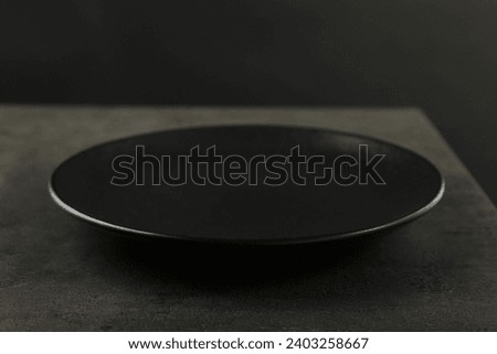 Beautiful ceramic plate on gray table, closeup