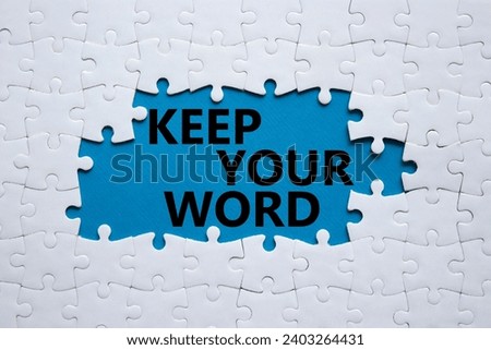 Keep your word symbol. Concept words Keep your word on white puzzle. Beautiful blue background. Business and Keep your word concept. Copy space.