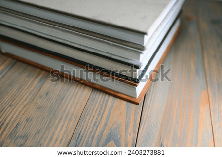 photobooks stacked on top of each other. the concept of making books and albums from photos. services of a professional photographer and printing house.