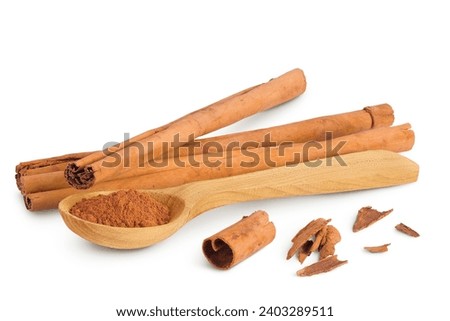 Cinnamon sticks with powder in wooden spoon isolated on white background with full depth of field Royalty-Free Stock Photo #2403289511