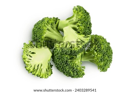fresh broccoli in wooden bowl isolated on white background close-up with full depth of field. Top view. Flat lay Royalty-Free Stock Photo #2403289541