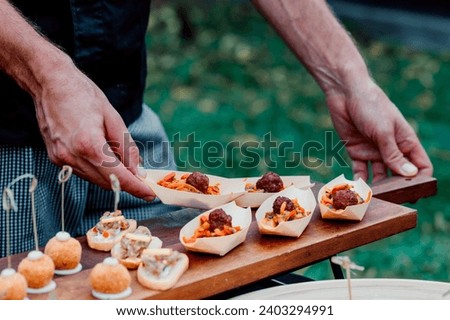 catering finger food served on plate by chef Royalty-Free Stock Photo #2403294991