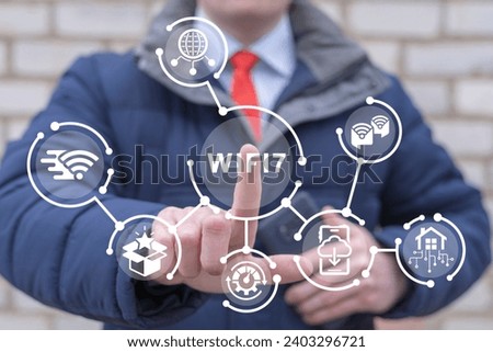 Man using virtual touchscreen clicks text: WIFI7. WiFi7 Next Generation Networking Communication Concept. Wi-Fi 7 technology new generation telecommunications connectivity network by smart performance Royalty-Free Stock Photo #2403296721