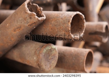 Rough cut old rusty pipes Royalty-Free Stock Photo #2403298395