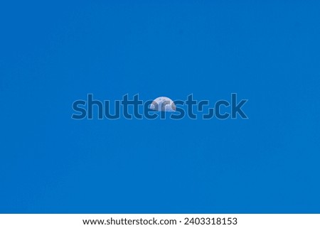 Half moon in blue sky in isolated background, abstract  background 