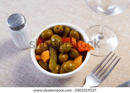 Image of assorted green olives, beautiful presentation of dish