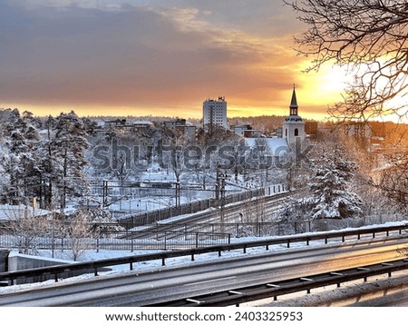 Beautiful winter picture of Huddinge Centrum with Huddinge Church in the foreground. Beautiful sunset and very wonderful picture. GoranOfSweden