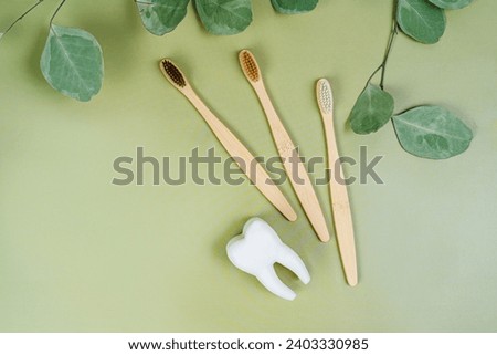 Tooth and eco tooth brushes on a beige background. Concept of dental examination of teeth, health and dental hygiene. Prevention of caries and tartar teeth.