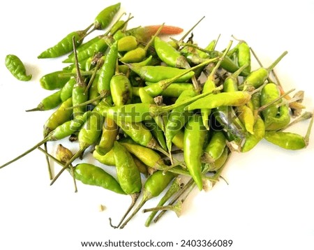 Top view of fresh green chili peppers placed hot green chilies or cayenne peppers stock photo isolated on white background