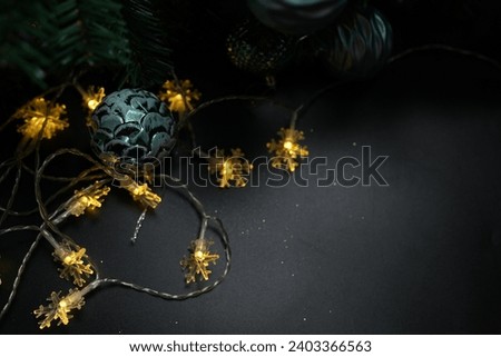 Christmas concept 2024 Christmas tree background. Christmas ball on a black background.