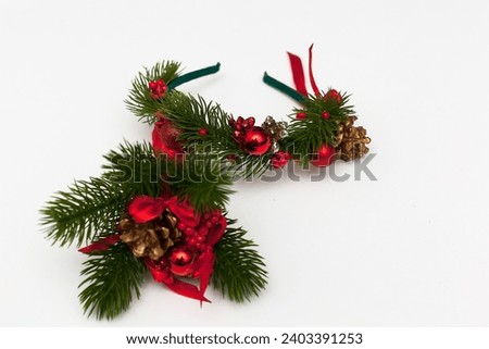Christmas or New Year's flat lay composition of various decorative elements, sparkles,stars and Christmas toys in red and golden tones on a white background. top view. copy space