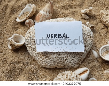 Verbal writing on beach sand background.
