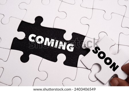 Coming Soon word alphabet letters on puzzle as a background