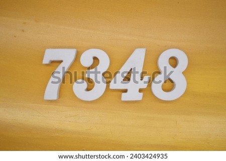The golden yellow painted wood panel for the background, number 7348, is made from white painted wood.