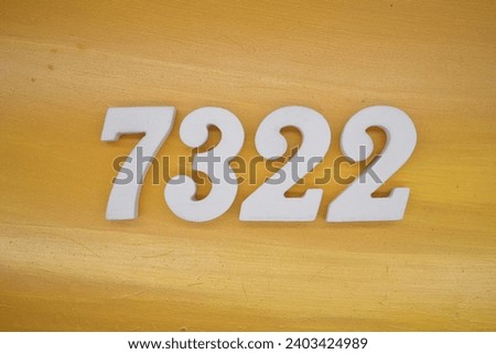 The golden yellow painted wood panel for the background, number 7322, is made from white painted wood.