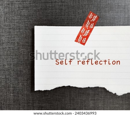 On wallpaper background, stick note with handwritten SELF REFLECTION, mental process to grow self understanding of who you are, values and why you think, feel, act the way you do Royalty-Free Stock Photo #2403436993