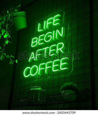 Bright green neon sign on the wall "Life begins after coffee"