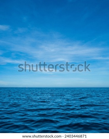 Landscape beautiful summer vertical horizon look view tropical shore open sea beach cloud clean  blue sky background calm nature ocean wave water nobody travel at Koh Muk Trang Thailand sun day time Royalty-Free Stock Photo #2403446871