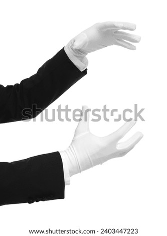Magician holding something on white background, closeup Royalty-Free Stock Photo #2403447223