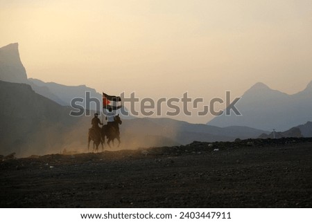 Pictures of horses in Oman, training for horse race, Arabic horse and horse show in sunset with flag of Palestina.