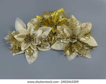 gold fake flowers fake artificial flowers Christmas tree ornaments, close-up photography Creative inventions can be used as greeting cards for New Year and Christmas.