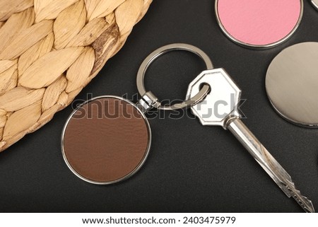 Metal and leather keychains. Brown color one side leather; Square, rectangle and circle shaped key rings. Concept shots, photos taken specially for e-commerce sales. Home key.