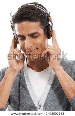 Happy, man and headphones in studio for calm playlist, audio subscription and streaming multimedia on white background. Model listening to peaceful music, hearing sound and relax for podcast on radio