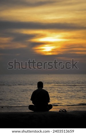 Man Sitting in Beach. Sunset View From Cox's Bazar, Bangladesh. High Resolution Stock Photos.