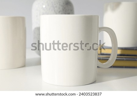 White classic cup on a light background