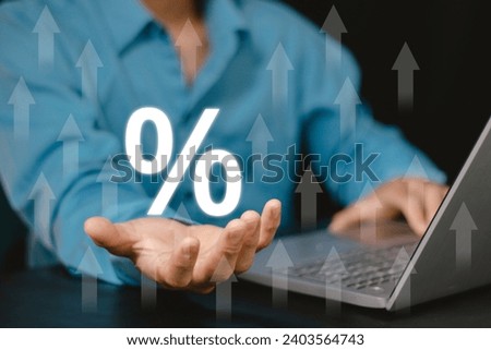 Businessmen using laptops with rising arrows and percentage icons. Planning and strategy, Stock market, Business growth, progress or success concept, Business growing virtual hologram stock
