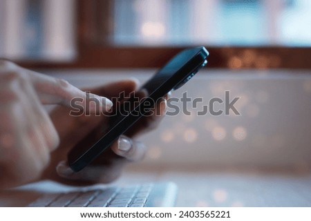 Social media marketing concept. businessman hand using smartphone typing, chatting conversation in chat box icons pop up in modern office 