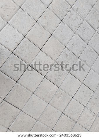  Concrete blocks are commonly used in construction for building walls and structures. They are made from a mixture of cement, sand, and gravel, and are known for their strength and durability.  Royalty-Free Stock Photo #2403568623