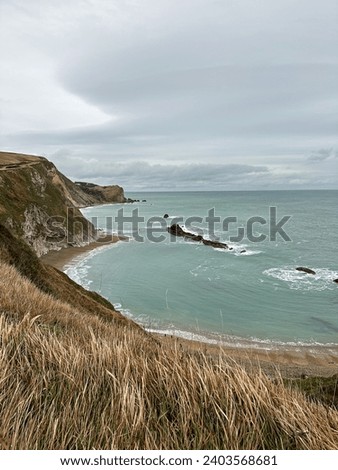 Man O'War Beach and Durdle Door on Jurassic Coast, Dorset, England. Scenic bay surrounded by Jurassic Coast rocks. Winter or autumn days. beautiful landscape and seascape view. English Channel. UK