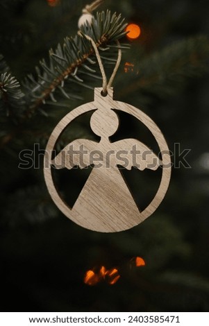 Angel Christmas decorations hanging on Christmas tree