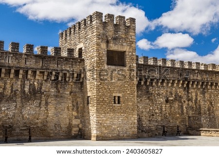Old medieval stone fortress walls of the city with battlements and a tower. Vitoria-Gasteiz, Basque Country, Álava, northern Spain. Royalty-Free Stock Photo #2403605827