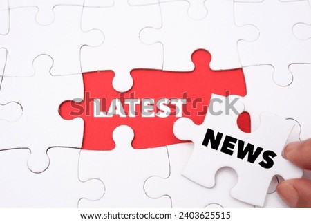 Latest News word alphabet letters on puzzle as a background